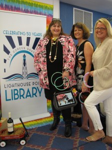 TOP-Library Director Christy Keyes with Friends of the Library volunteers Suzanne Marquette Esposito and Carolyn Bergamai.